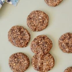 a photo of freshly baked oatmeal cookies on a green ground