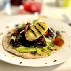 Taco with banana, hibiscus, beans and gucacamole