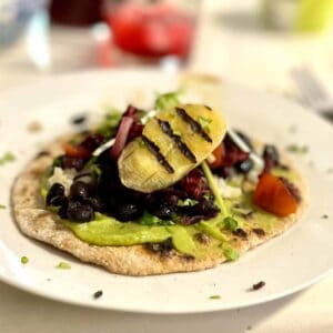 Taco with banana, hibiscus, beans and gucacamole