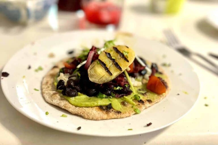 Taco with banana, hibiscus, beans and gucacamole