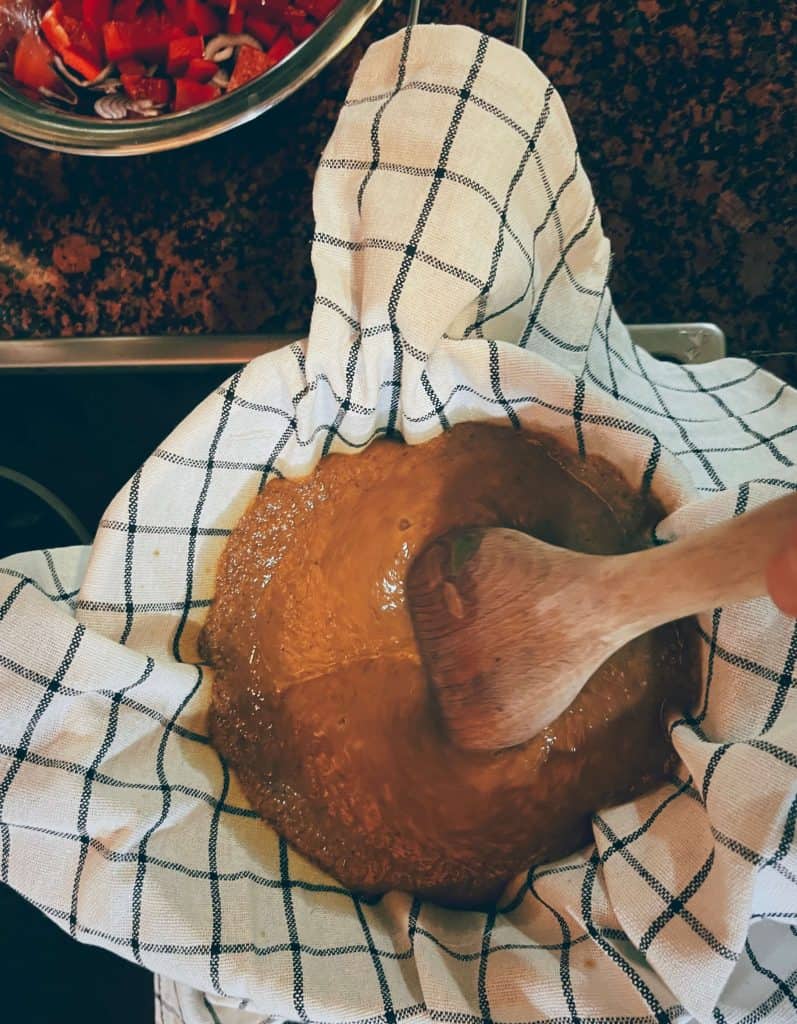 mushroom gravy sauce filtration with kitchen towel