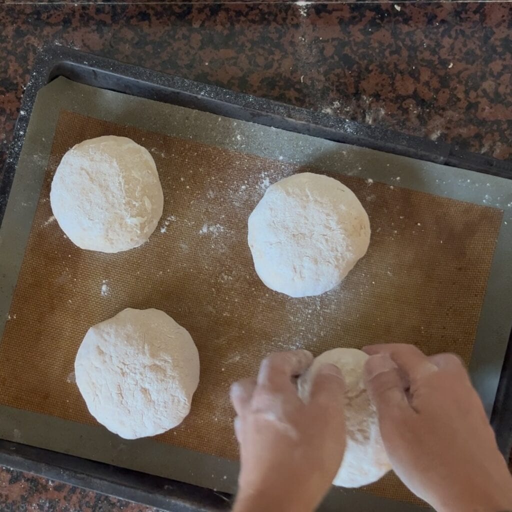 A photo showing the bread rolls being prepared for the second proofing phase.