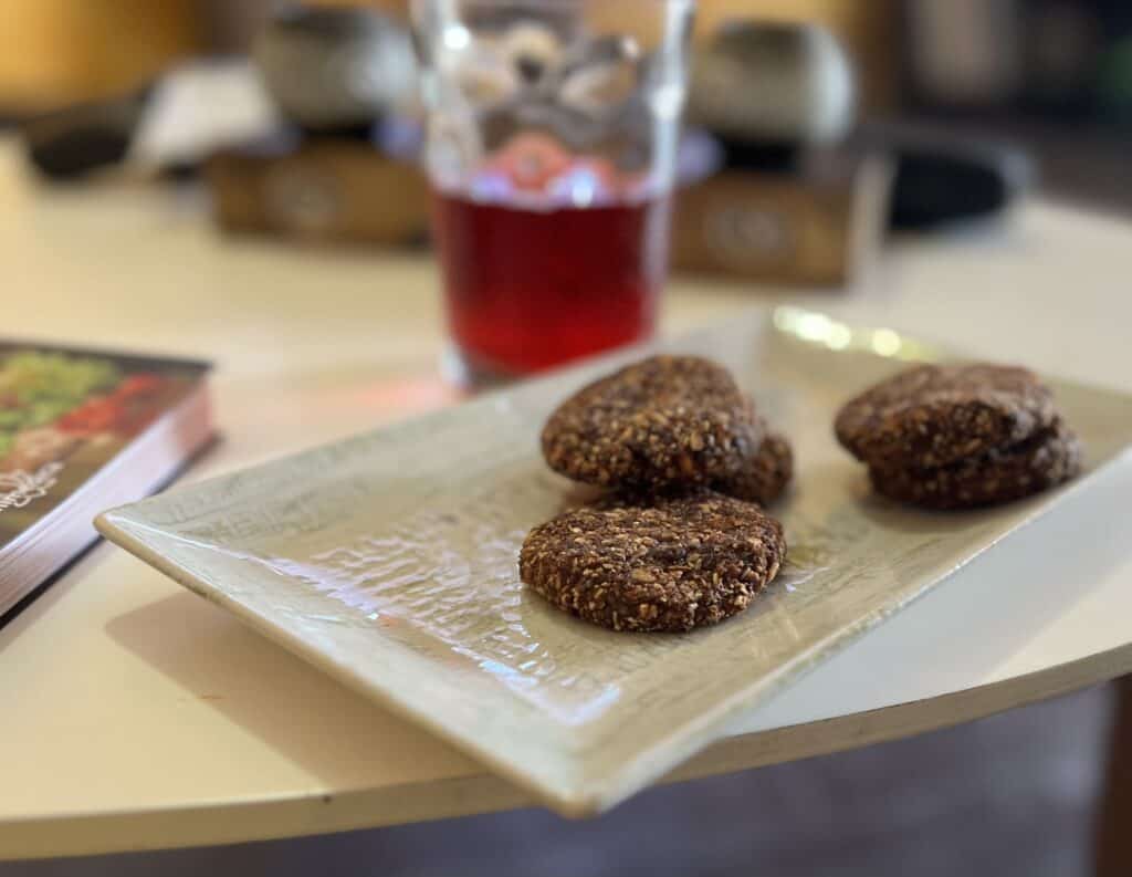 Plated oatmeal cookies on a couch table