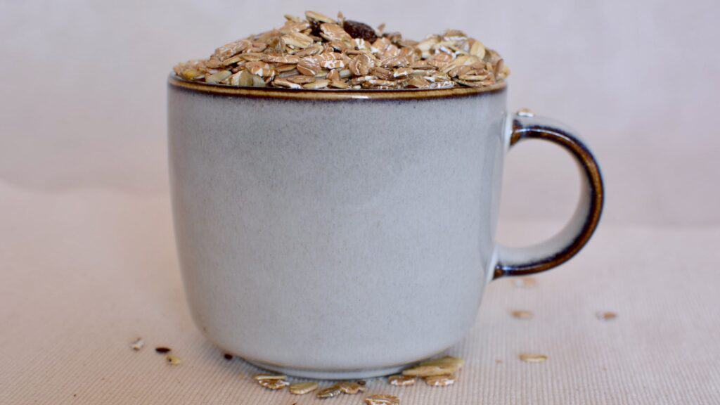 a coffee mug filled with oats