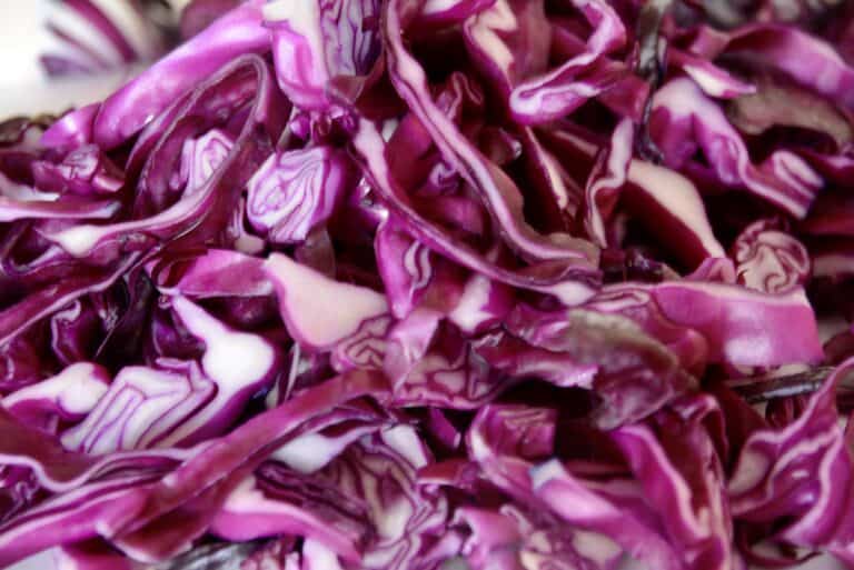 A photo showing a pile of red cabbage cuts